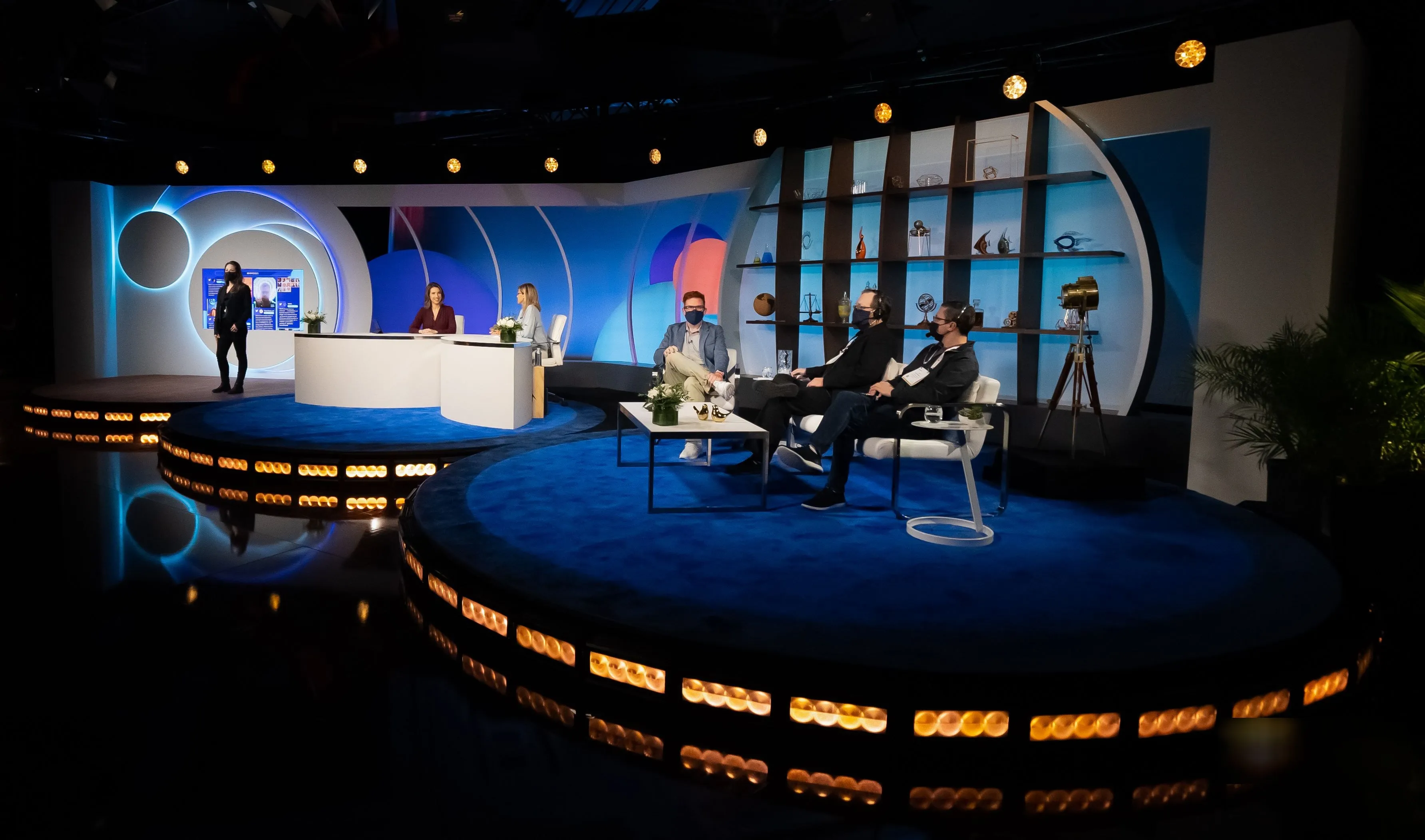 The finished studio in Las Vegas: anchors at the news desk, guests in the interview area